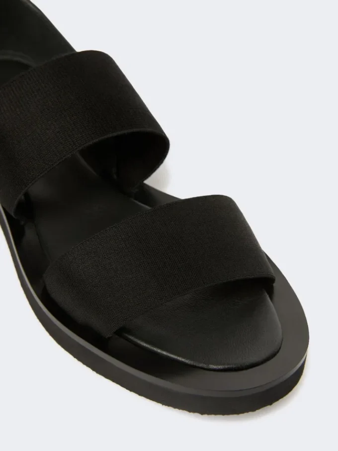 Flate sandaler i skinn og elastisk bånd, svart