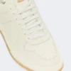Lavskosneakers i tumlet skinn, hvite
