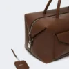 Stor bostonbag i skinn med lommer, brun